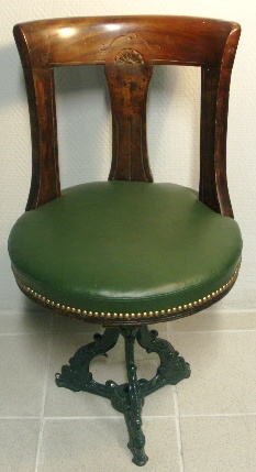 Swivel-chair in mahogany with cast-metal base. Leather seat. Late 19th century.